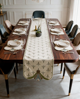 The Barg table runner in Sage & Teal running the length of a formal dining table set for eight with matching placemats.