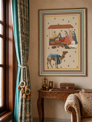 Framed Bazar Heritage wall art above a carved wooden console beside a teal curtain in a warm living room
