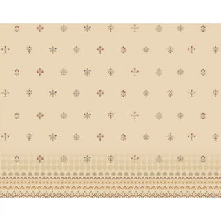 A full view of the beige Indian motif wallpaper, showing the elegant repeating floral-inspired patterns evenly spread across the wall.