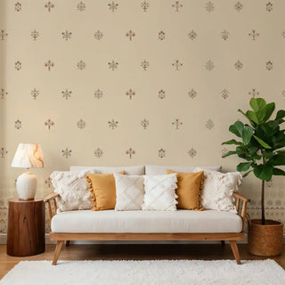 A beige wallpaper with repeating traditional Indian motifs, applied to a living room wall behind a modern sofa, creating a warm and cultural-inspired ambiance.