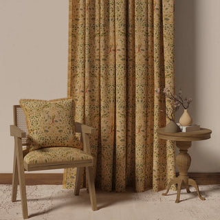 The Bird Tapestry Fringes curtain displayed in a room setting with furniture, showcasing its full-length and classic appearance.