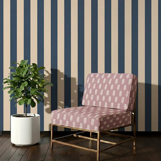 Bloomark Sofa and Chair Upholstery Fabric in mauve with white block-inspired motifs, styled on a lounge chair.