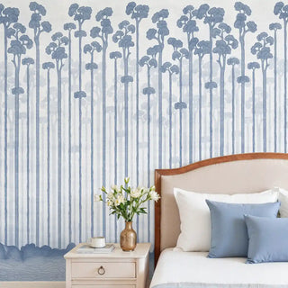 Blue Ascent Wallpaper: View of the blue misty forest mural installed in a bedroom behind a headboard.