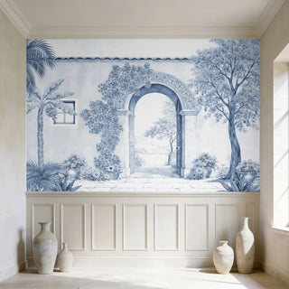 A high-end interior showing The Silent Portico mural styled above classical white wall paneling with large ceramic floor vases.