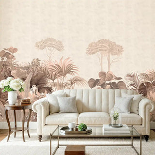 A blush-toned wallpaper featuring tropical trees, foliage, and plants in soft sepia shades, styled behind a cream sofa with modern decor.