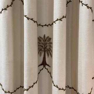 Close-up of Botanical Bliss Curtain showcasing its delicate embroidery with floral and leaf-inspired motifs arranged in a repeating pattern.