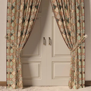 The Chaap Pipin curtain in a room, hanging in front of a door, showing how its elegant patchwork design frames the space.