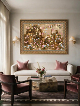 The Chinoiserie Gardens of Antiquity wall art framed above a cream sofa with dusty pink velvet chairs and cushions.