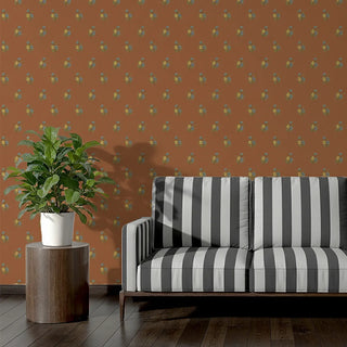 Black and white striped sofa upholstery fabric against a patterned wall with a plant on a small table.