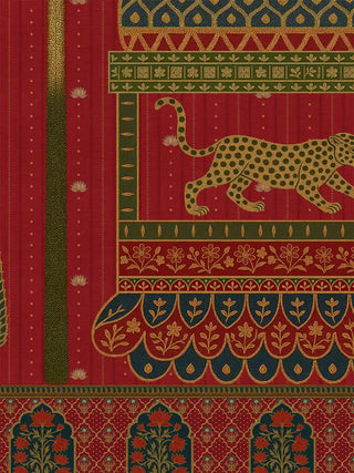 A close-up of the Chitrakar wall art showing a spotted big cat in a domed pavilion above scalloped petals, a palm trunk and an arched floral border.