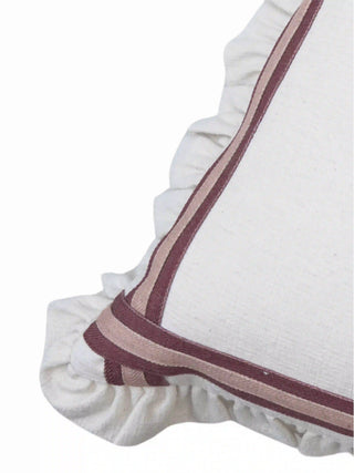 A high-resolution close-up of the mitered cinnamon plum and dusty rose grosgrain ribbons and gathered ruffle edge.