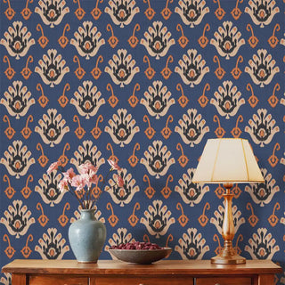 A room view of the Classic Nomad Wallpaper in blue, showing its repeating symmetrical patterns across the wall.