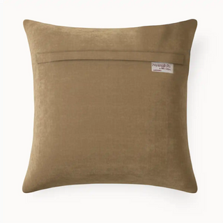 Back view of Corner Saddle Cushion, its modern, minimalist design on a rich brown velvet fabric.