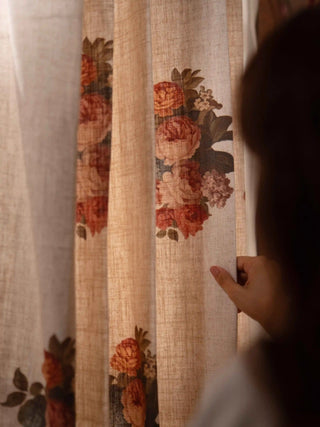 Close-up of the Cotswold curtain in natural beige with rust and pink rose bouquets and olive green leaves.