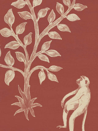 A close-up of the Crimson Garden wall art showing a seated monkey beneath a leafy silhouette tree.