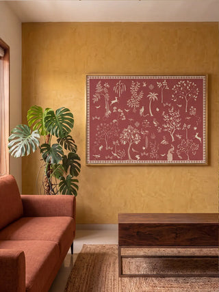 The Crimson Garden wall art framed on a mustard-toned wall beside a terracotta sofa and monstera plant.