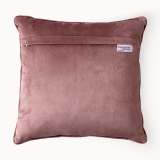 back of the blush velvet cushion cover featuring a hidden zipper and brand tag