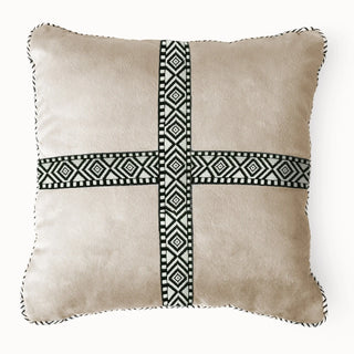 Front view of the Cross Weave cushion featuring beige velvet and a black and white geometric cross pattern.