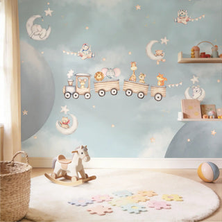 The Cuddly Express mural styled in a minimalist playroom featuring a rocking horse and a white circular rug.