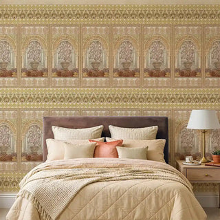 A warm bedroom setting featuring the Dastaan mural in yellow behind a quilted bedspread and neutral linens.