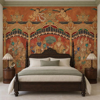 The Deva Sabha wallpaper in Terracotta & Gold covering the wall behind a carved dark-wood four-poster bed with cream and sage linen.
