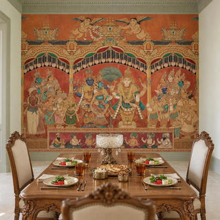 The Deva Sabha wallpaper in Terracotta & Gold covering the wall behind a carved wooden dining table set for a meal.