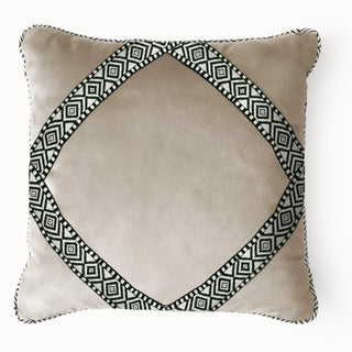 Front view of the Diamond Weave cushion cover featuring beige velvet and a black and white geometric diamond embroidery.