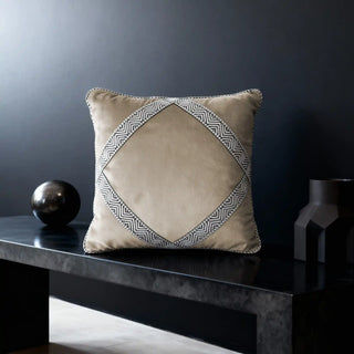 Single Diamond Weave Cushion Cover displayed on a black bench in a dramatic setting.
