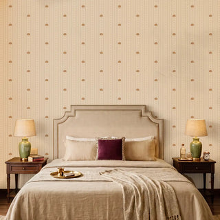The Doriya luxury lotus striped wallpaper installed as a full feature wall behind a neutral upholstered bed in a master bedroom layout.