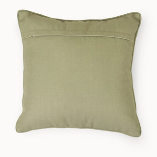 The back view of the Eka Kanan cushion featuring a solid sage green fabric and secure hidden flap closure.