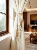 Ranjha Parrot embroidered tieback in luxury living room with sunlit window