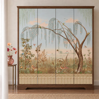The Enchanted Grove multicolor wallpaper mural across the doors of a four-door walnut wardrobe, with a weeping willow, ferns and an arched trellis border view-wardrobe