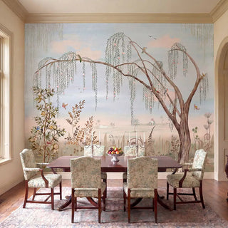 The panoramic Enchanted Grove watercolor willow tree wallpaper providing a storied focal backdrop in a luxury formal dining room layout view-diningroom