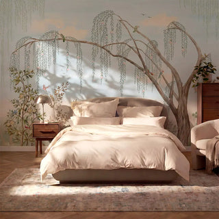 The Enchanted Grove landscape mural creating an expansive, peaceful pastel accent statement wall behind a contemporary low-profile bed view-bedroom