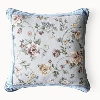 Front view of the Eternal Garden blue cushion cover featuring a hand-painted floral tapestry and blue velvet border.