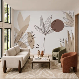 Beautiful Floral Leaves wallpaper in Brown and Beige behind a cream sofa and rust-colored armchair in a living room