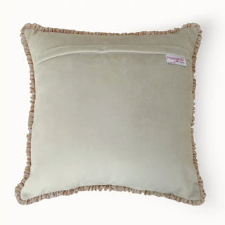 The back view of the Florence Frieze cushion showing the premium velvet finish and brand label.