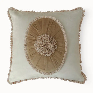 A direct front-facing view of the Florence Frieze cushion highlighting the central sunburst pleats and rosette.