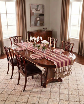 table-mats-maroon-formal-dining	Florentine Ruffles maroon and cream striped table mats with hand-stitched ruffled edges styled in a formal dining room with white orchids and crystal glassware.