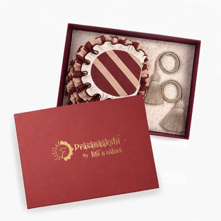The Florentine Table Mats & Tieback Gift Set in Burgundy & Blush, with its maroon Prasanaakshi by Life n Colors branded gift box.