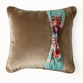 Full studio view of the Florid Belle Knot Cushion with tawny velvet and teal floral knot.
