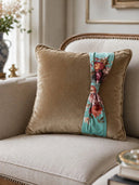 Brown floral pillow cushion cover with floral ribbon on a beige sofa in a living room setting