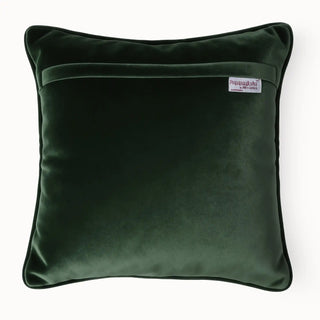 The matching velvet reverse side of the forest green cushion showing the brand label and concealed zipper.