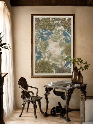 The Forest Nest framed landscape art print providing an expansive cultural focal point above an ornate table in an elegant, neutral-toned lounge hall.