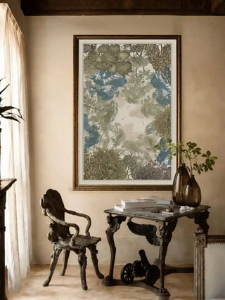 The Forest Nest wall art with treetop canopy and flying birds framed above a carved wooden chair and vintage side table