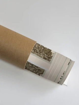 The Forest Nest wall art rolled and packed securely inside a kraft cardboard shipping tube
