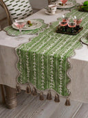 The Garden Gala table runner providing a palatial botanical highlight down the center of a rustic wooden formal dining layout.