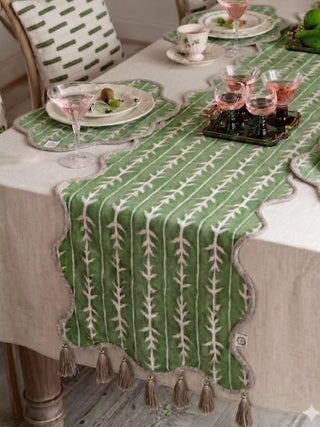The Garden Gala table runner providing a palatial botanical highlight down the center of a rustic wooden formal dining layout.