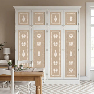 A luxury dining room setting featuring the Gazal wallpaper used as artisanal panels within a large white cabinet unit.