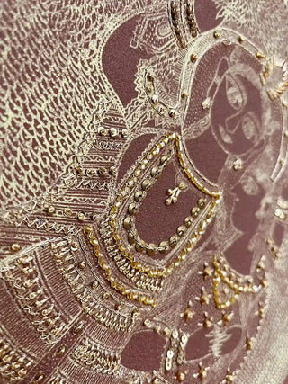 A detailed close-up of the Geet Madhubani embroidered wall art highlighting rows of gold bugle beads, sequins and knotted thread over fine line work